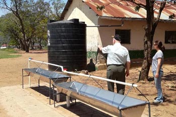International Development Charity assess water tanks